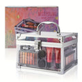 Clear, rectangular makeup vanity case with silver trim containing eyeshadow, lip gloss, and applicators.