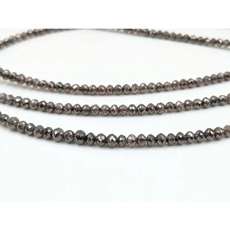 Close-up of faceted rondelle diamond bead strand on multiple loops