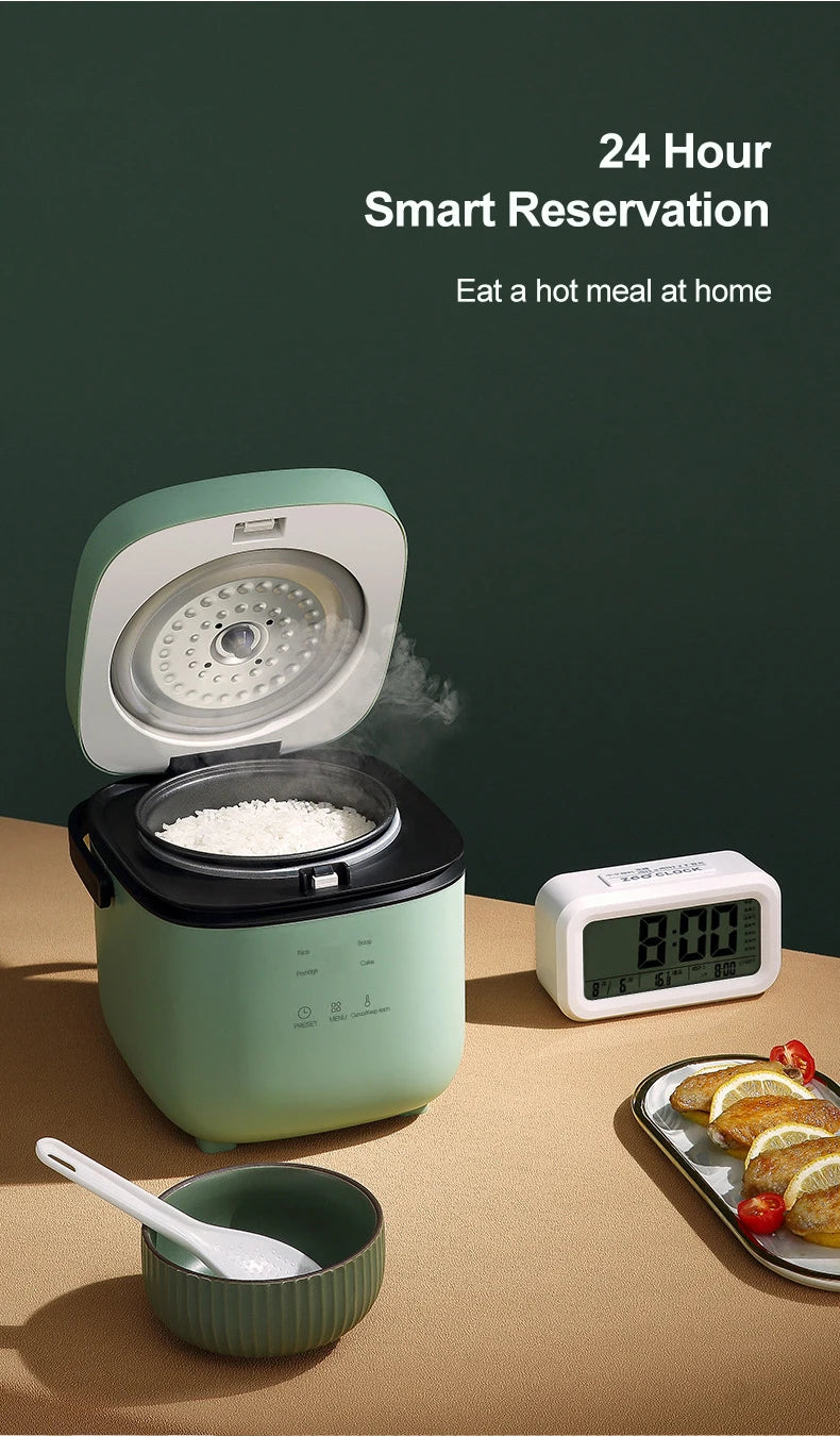 Mint-green rice cooker with open lid and digital timer, steaming rice inside