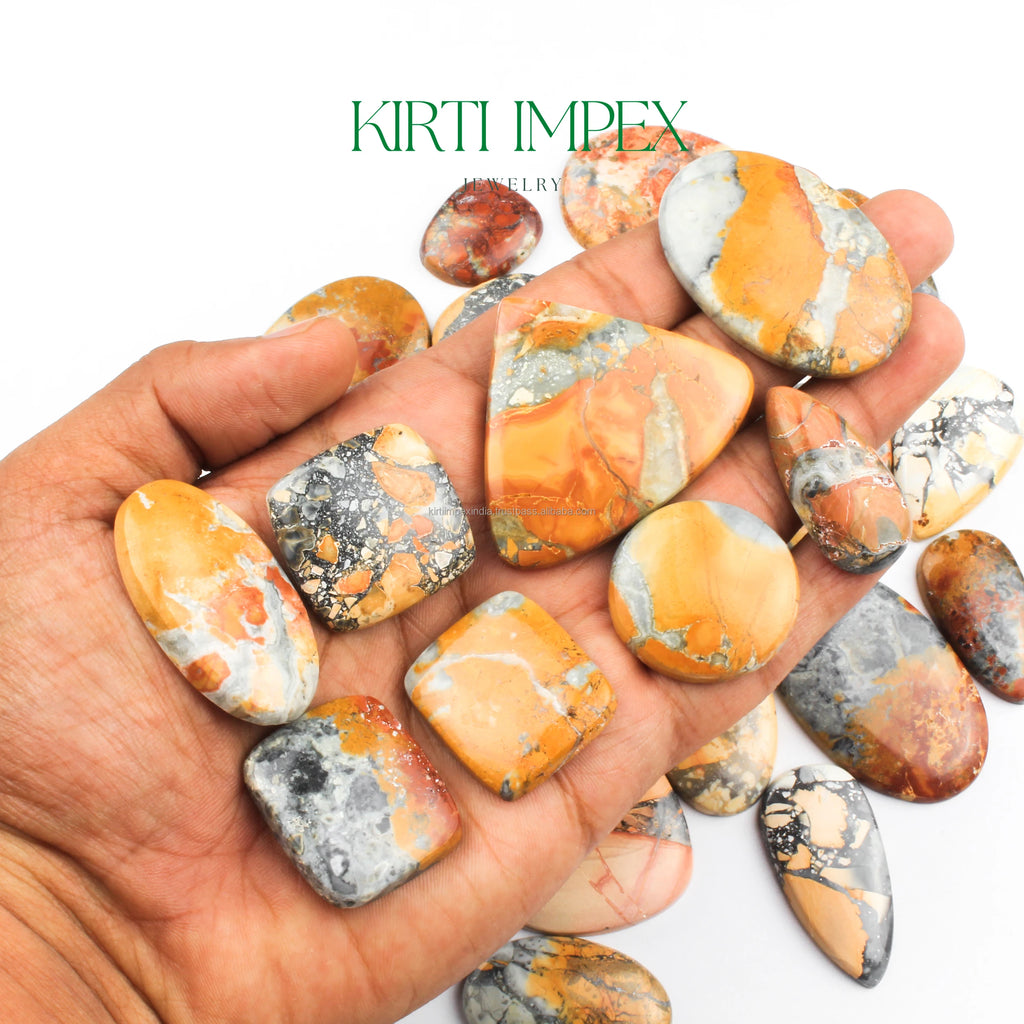 Orange and gray jasper cabochons in palm, natural flat-back loose gemstones