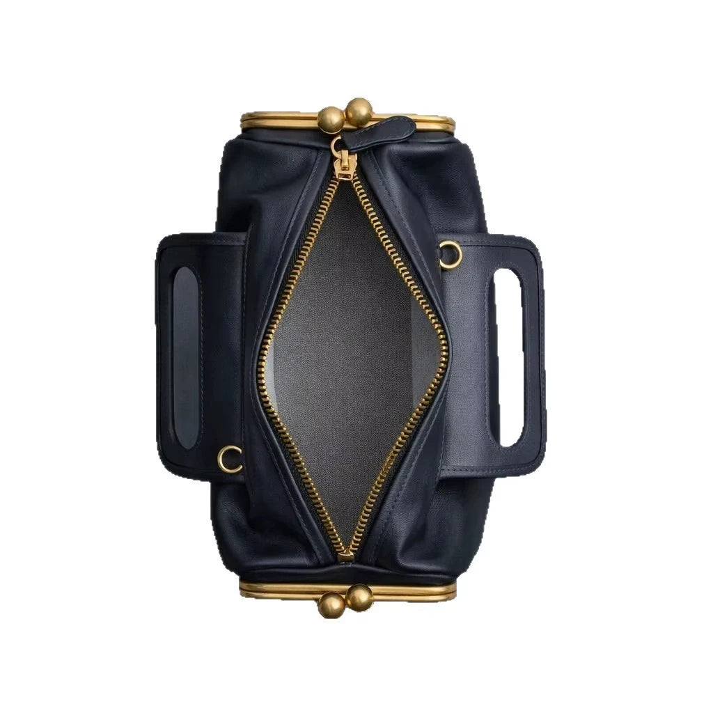 Navy blue retro PU pillow handbag with gold kiss-lock clasps, top zipper, and structured side handles. Designer style.