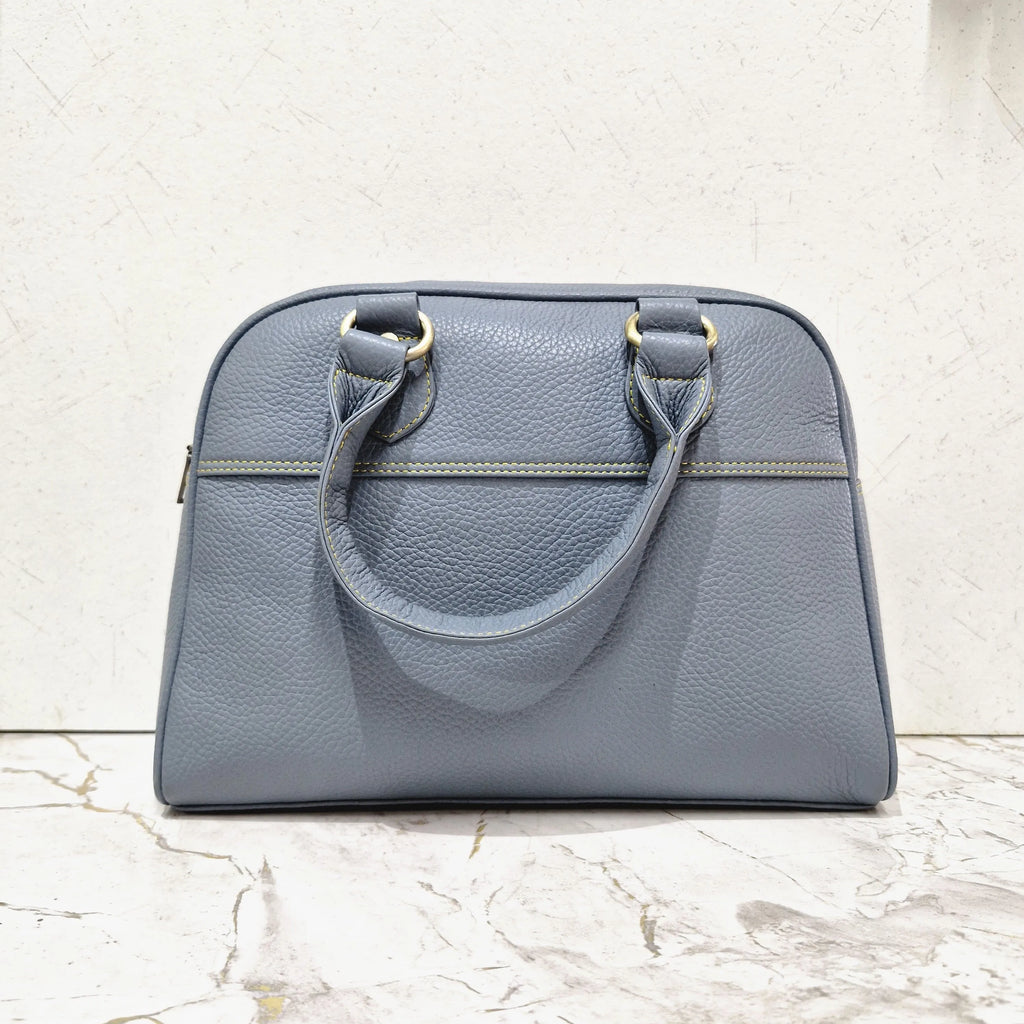 Blue genuine leather designer mini tote bag with dual handles, contrast yellow stitching, and gold-tone hardware.