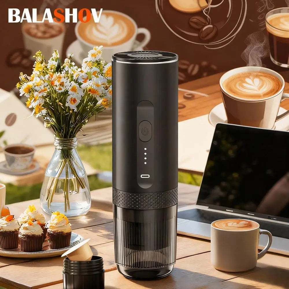 Balashov portable black electric coffee maker with LED status indicator on a table next to a cup and laptop.
