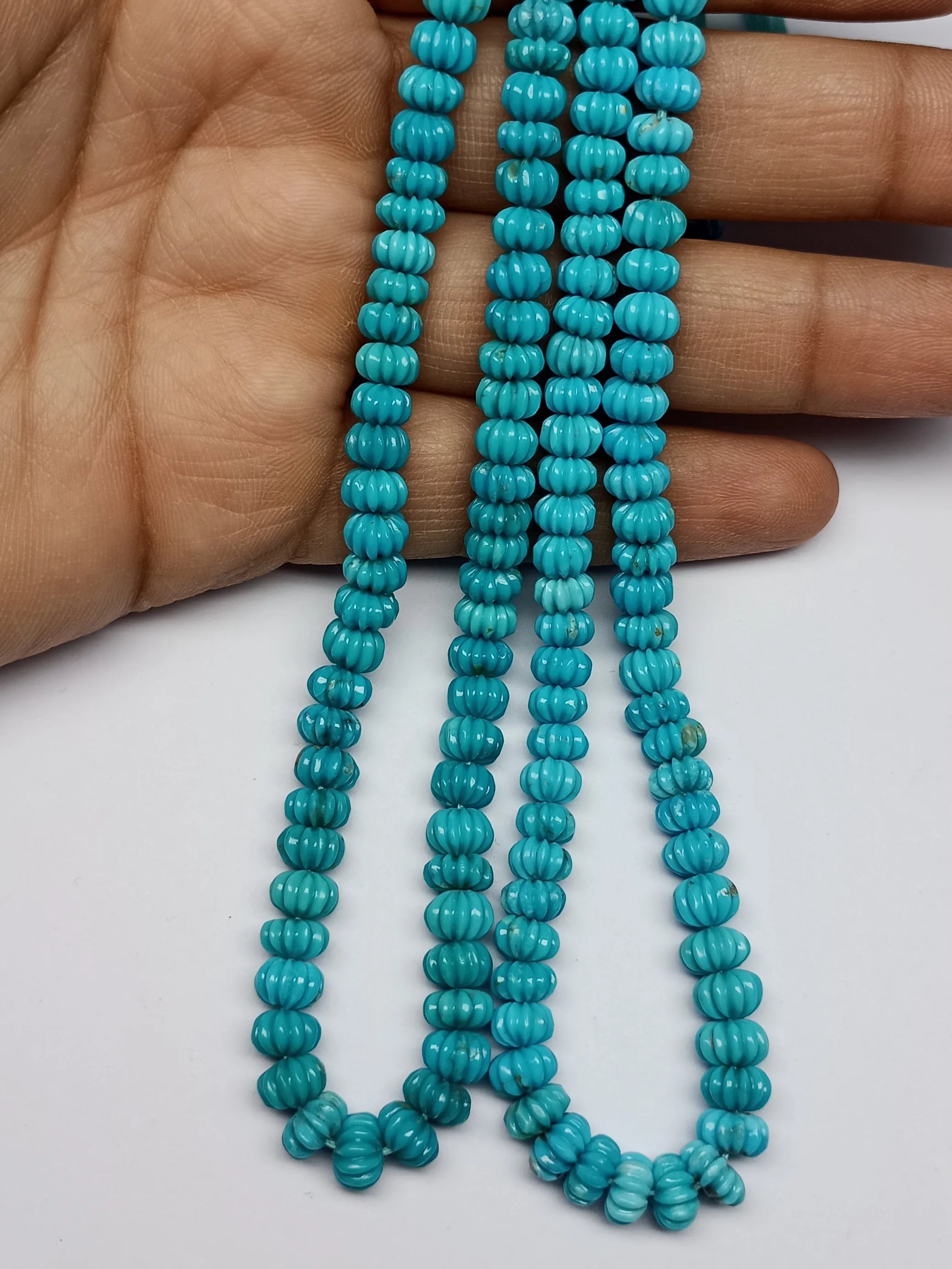 Blue turquoise carved pumpkin-shaped beads, three bead strands with pumpkin-carved ridges