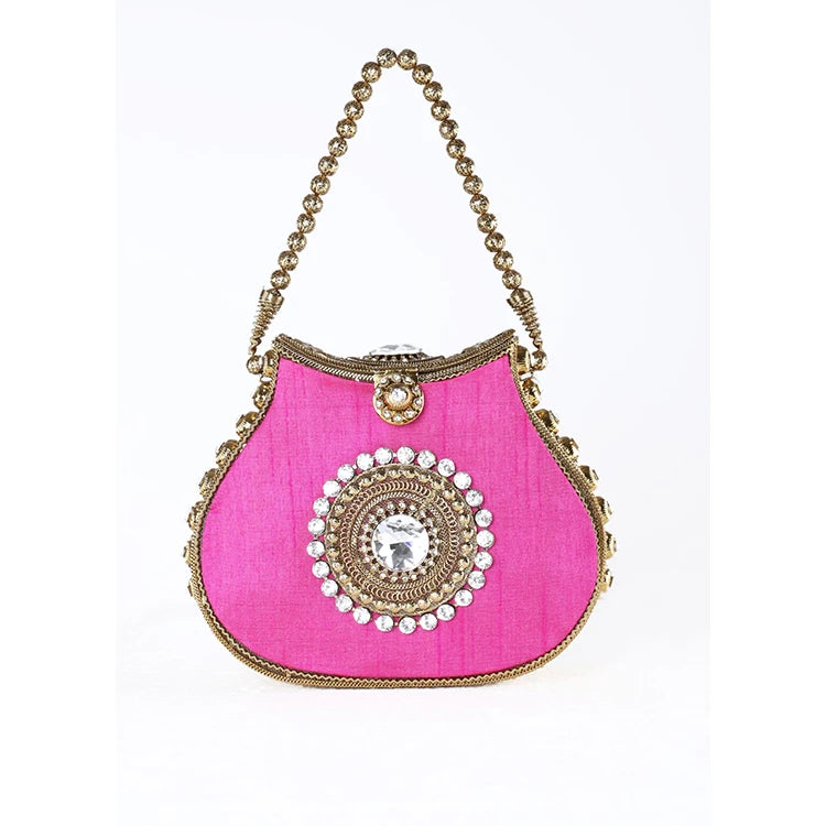 Hot pink silk designer handbag with gold beaded handle, ornate crystal center medallion, and vintage kiss lock closure.