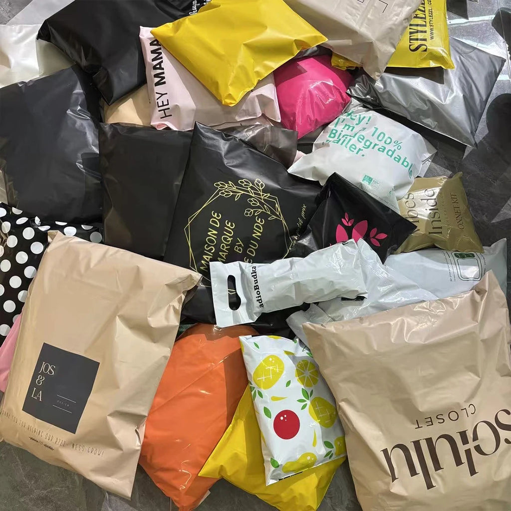 Assorted poly mailing bags with printed custom logos in multiple colors, waterproof shipping