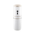 White portable electric coffee maker with locking lid, compact cylinder design for travel, and minimalist buttons.