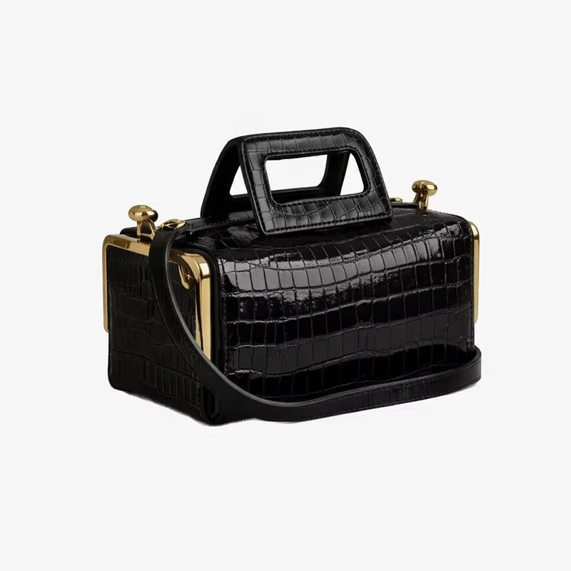 Black crocodile-embossed PU designer handbag with gold-tone clasp and structural top handle.
