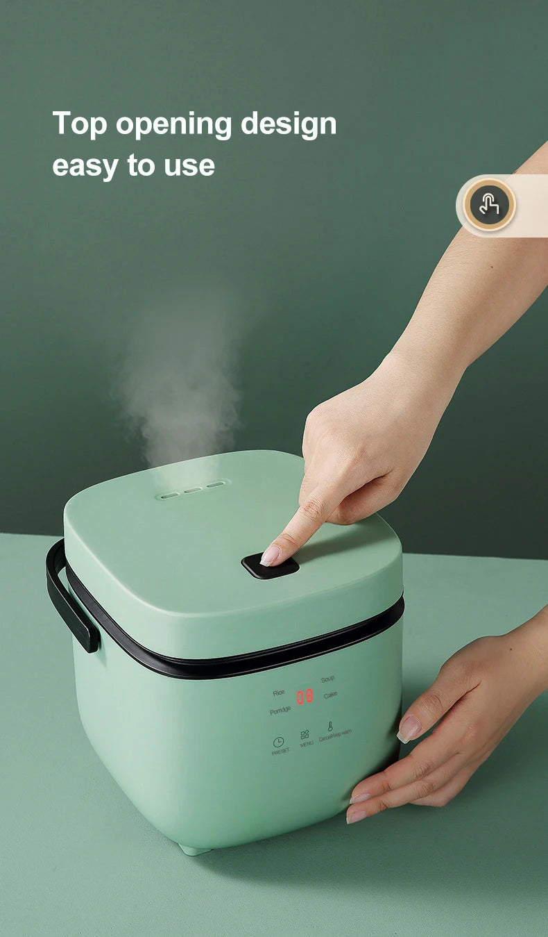 Mini electric rice cooker showing top-opening lid design, mint green exterior with black side handles