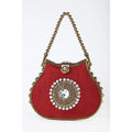 Red silk designer clutch with gold metal bead handle, crystal center medallion, and kiss lock closure.