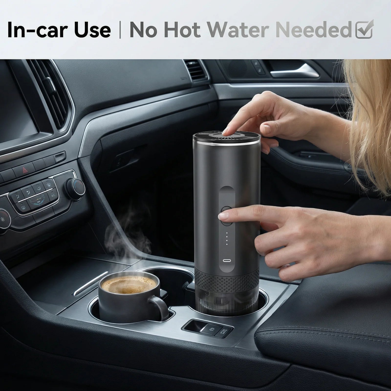 Portable dark grey electric car coffee maker heating espresso in a cup holder for on-the-go brewing.