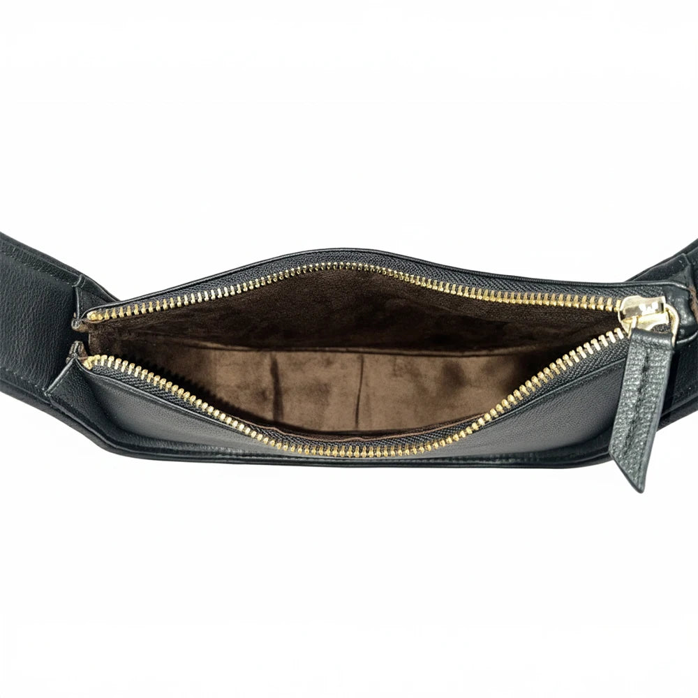 Black genuine leather designer crossbody bag with gold zipper and brown suede-lined interior.