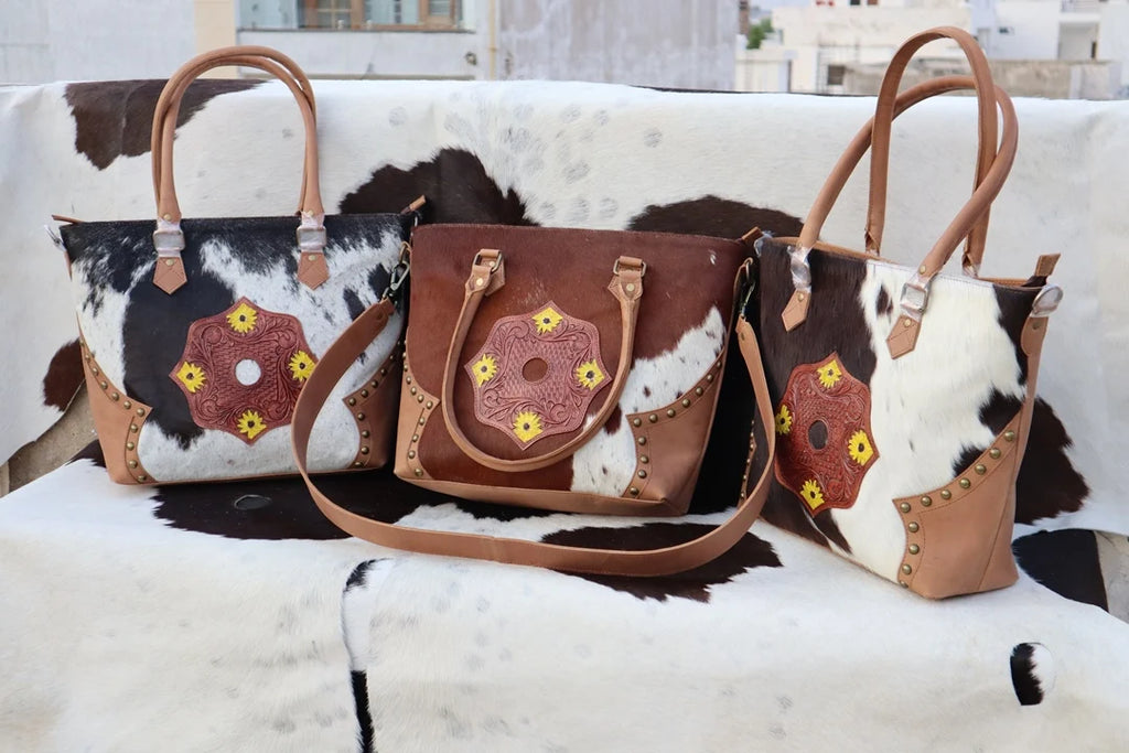 RABADA western fur leather handbags with tooled floral patches, zipper closure, and dual carrying chains.