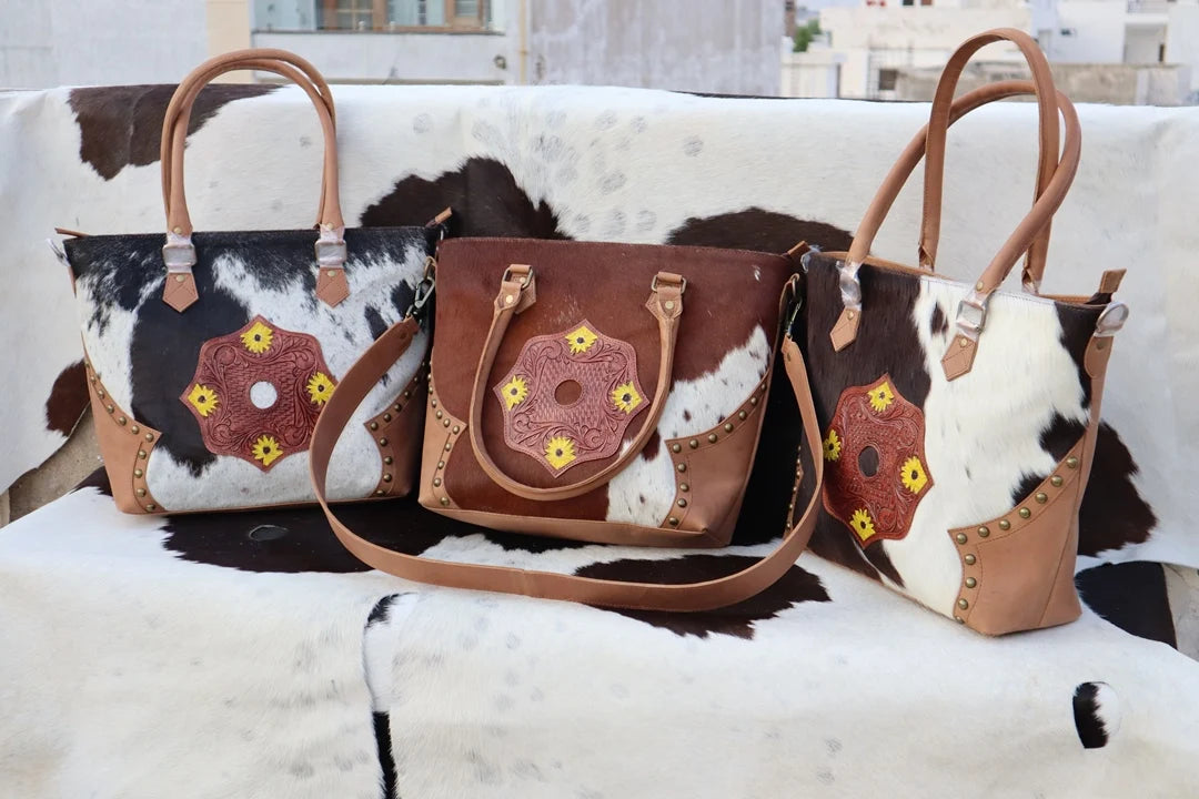 RABADA western fur leather handbags with tooled floral patches, zipper closure, and dual carrying chains.