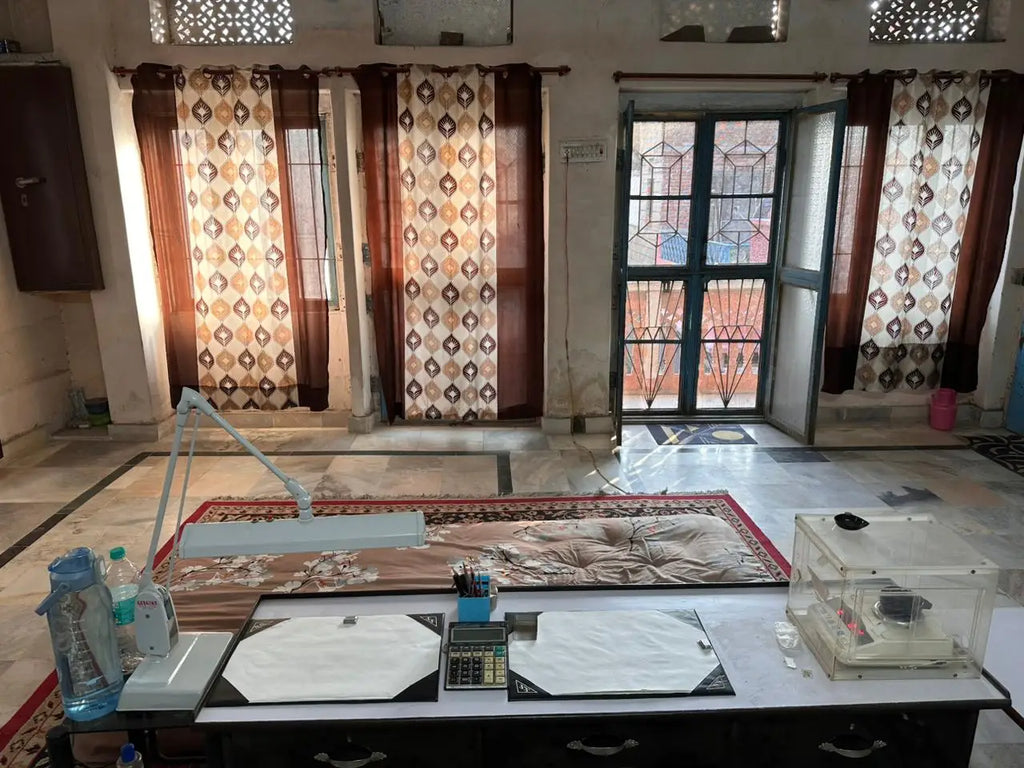 Indoor room with tables, curtains, and multiple windows