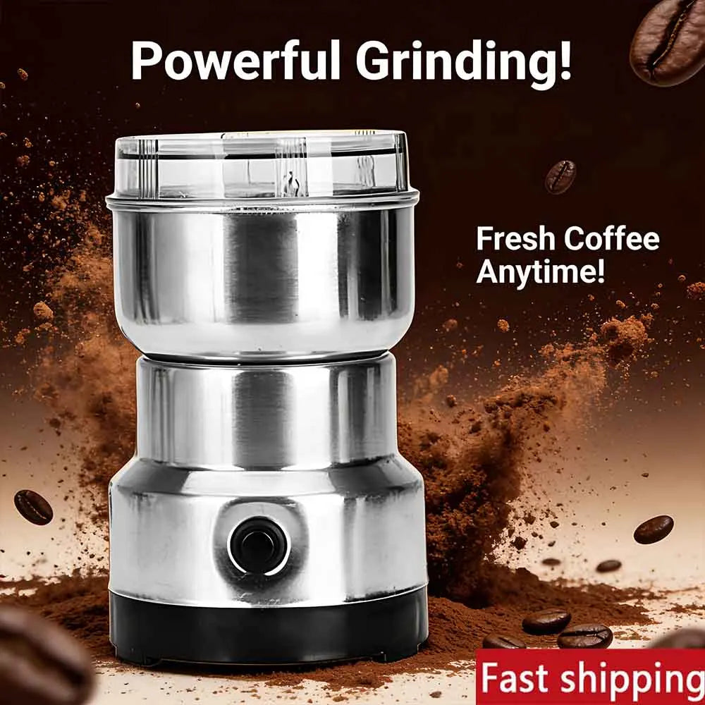 Compact stainless steel electric coffee bean grinder with a clear lid for fresh grinding, isolated on brown background.