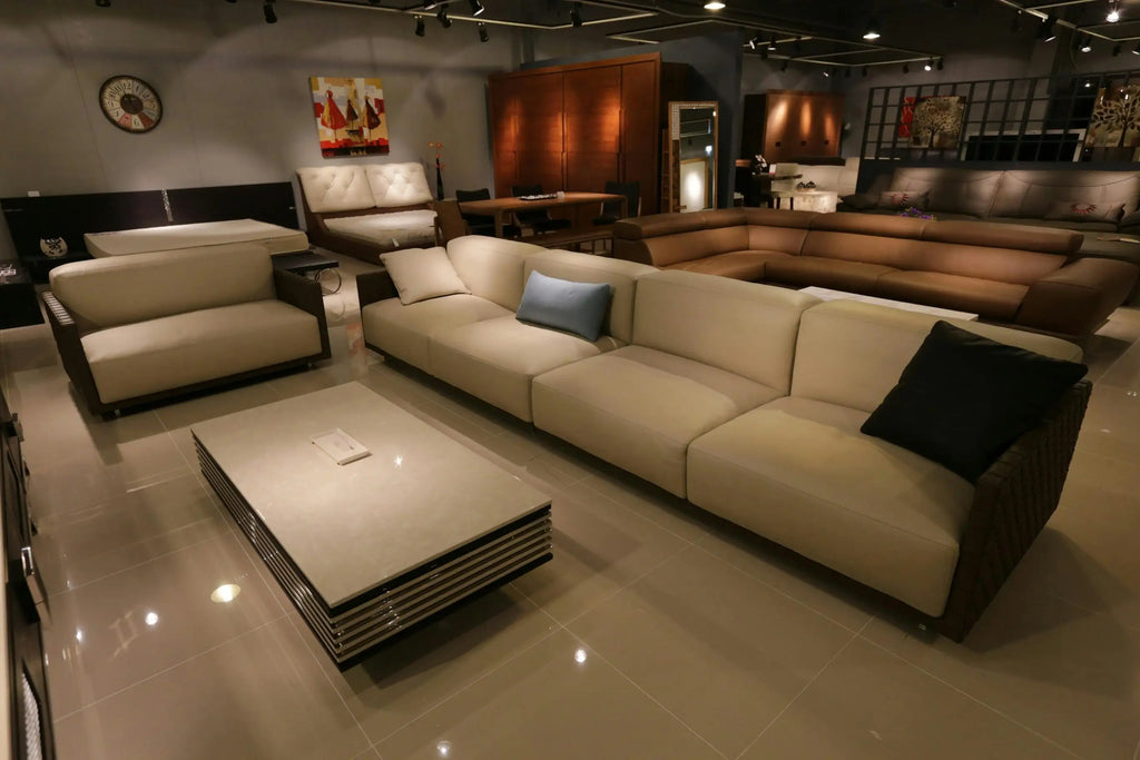 Modern beige sectional sofa with matching cushions in showroom