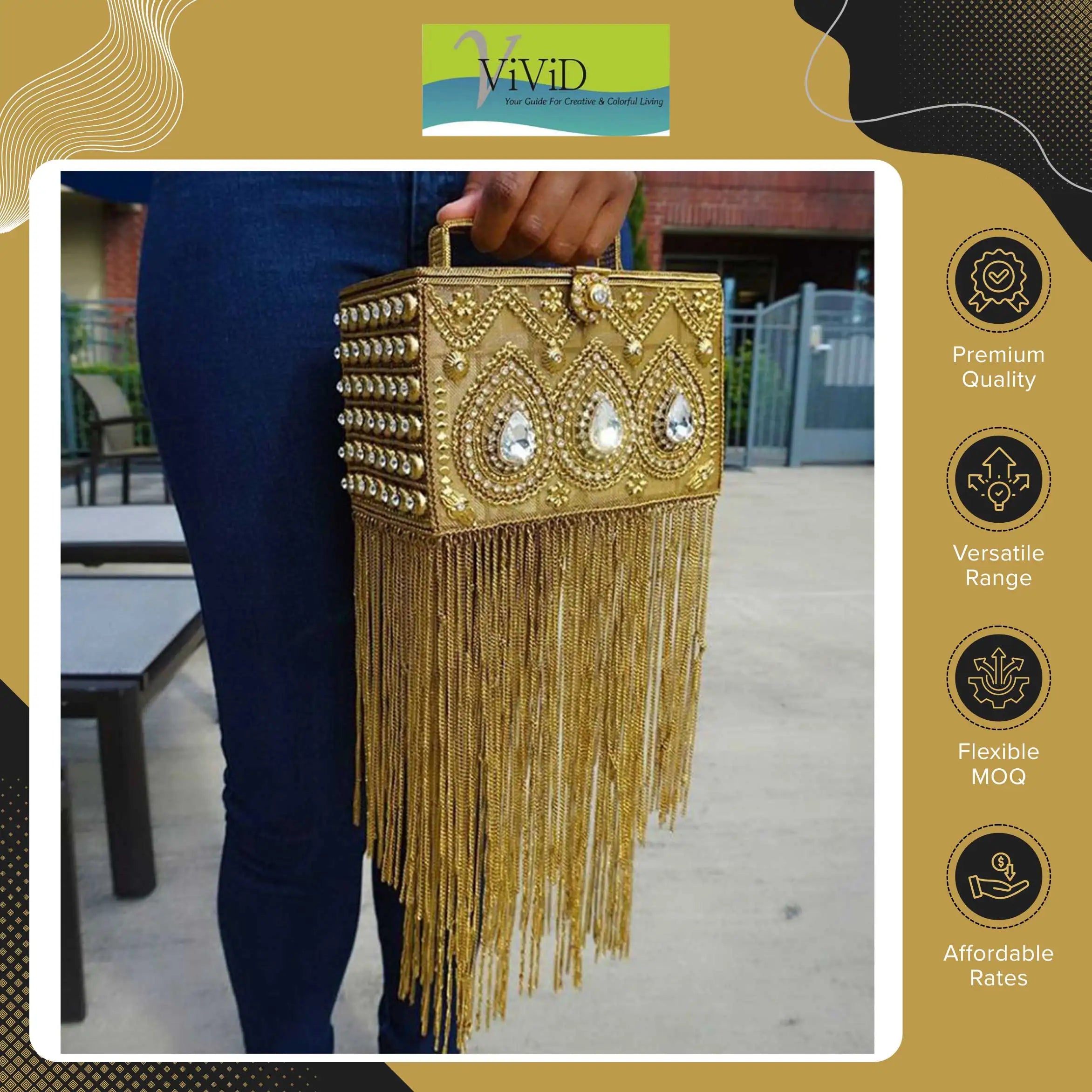 Gold silk box clutch with crystal embellishments and long metal chain fringe, stylish designer handbag.