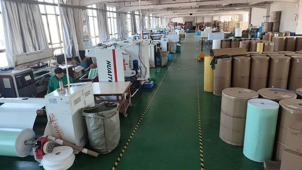 Warehouse aisle with rolls and boxes for roof flashing tape storage
