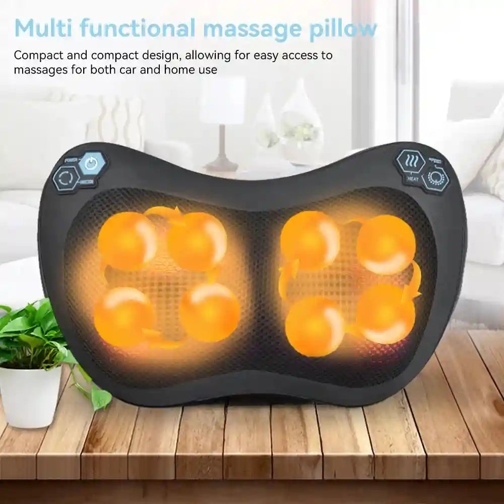 Black ergonomic Shiatsu massage pillow with glowing orange kneading nodes and control buttons, set on a wooden table.