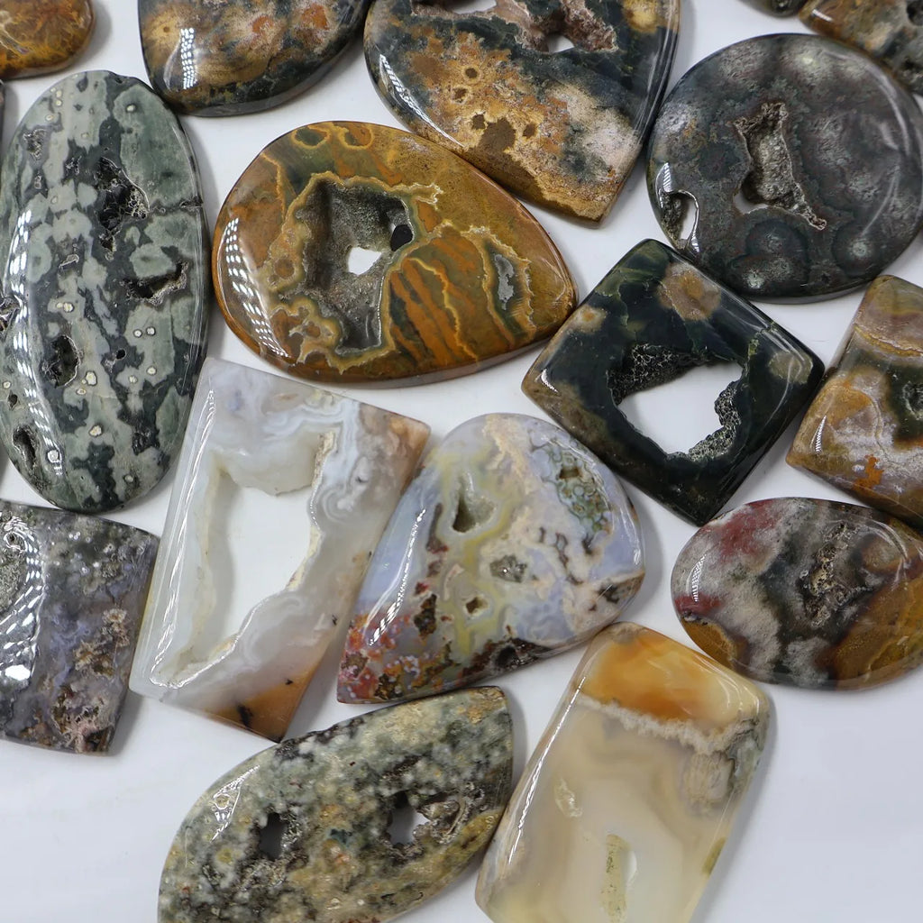 Assorted ocean jasper cabochons with druzy texture, mixed oval and rectangle settings