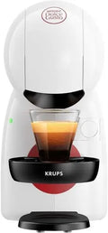White Krups Nescafe Dolce Gusto capsule coffee machine with a glass of fresh espresso.