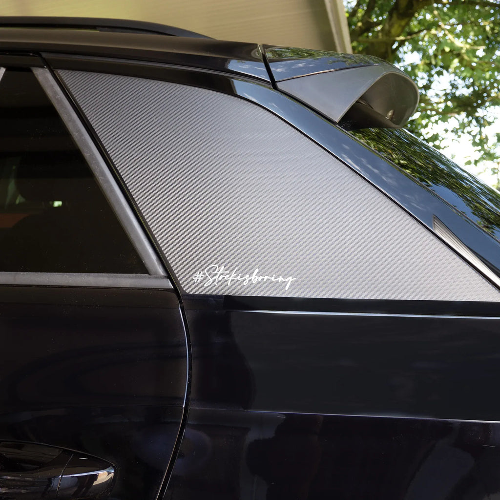 Simon Racing silver script sticker 'Stockisboring' on car side window
