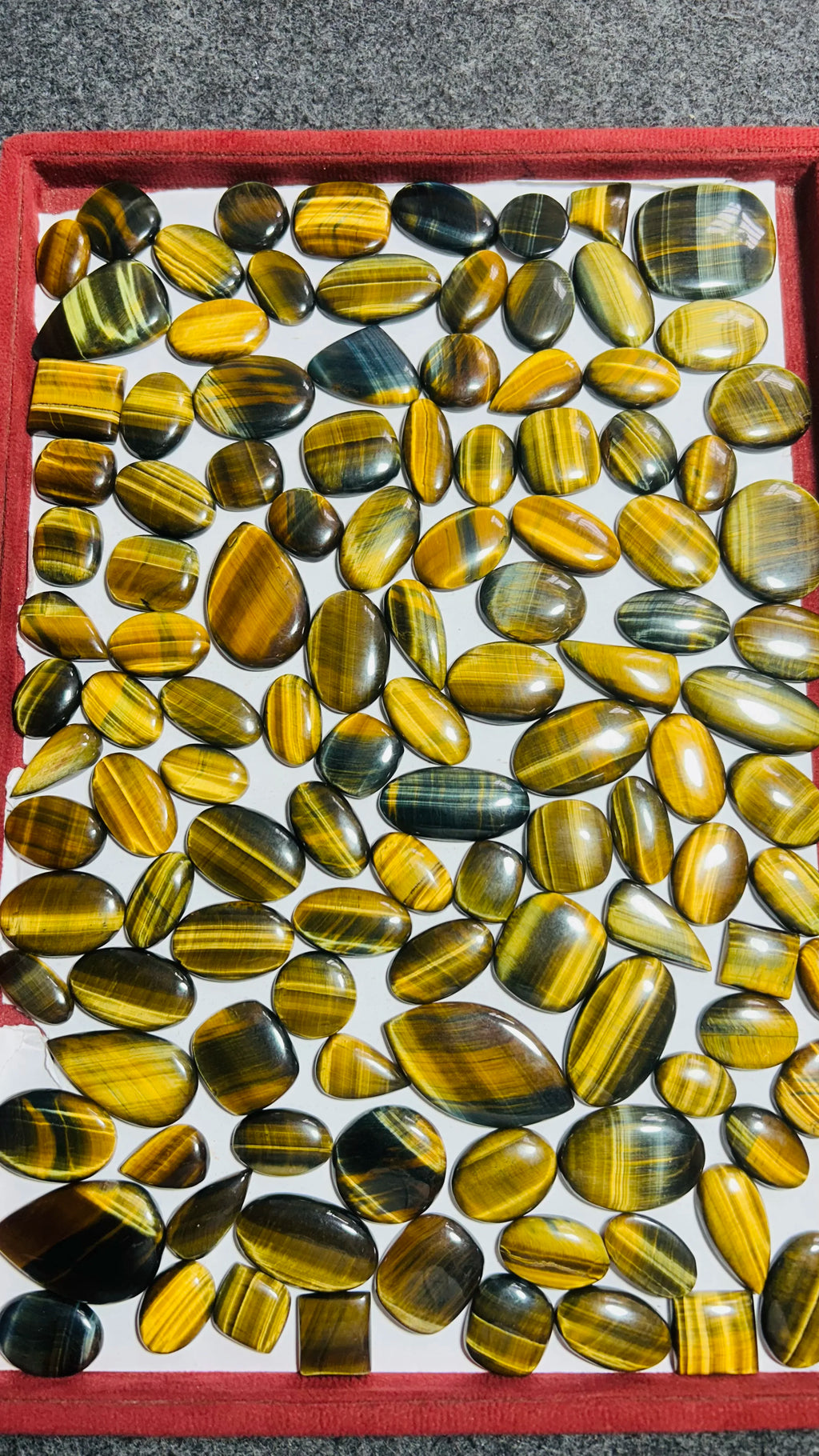 Loose striped cabochon gemstones in mixed sizes, oval and teardrop shapes