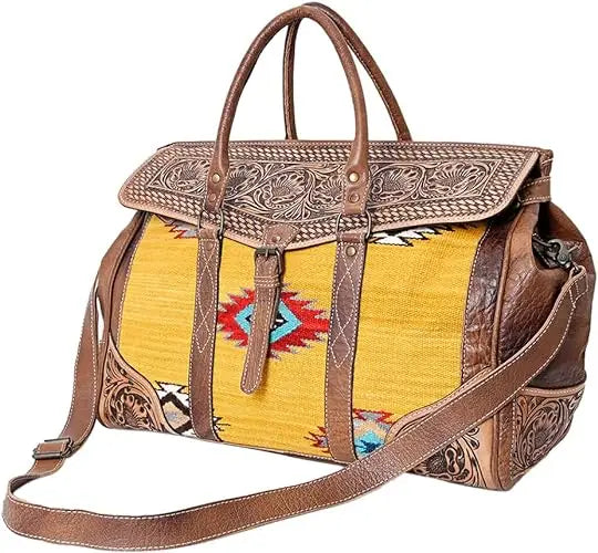 Bohemian hand-tooled leather trunk bag with yellow Aztec saddle blanket fabric and adjustable shoulder strap.