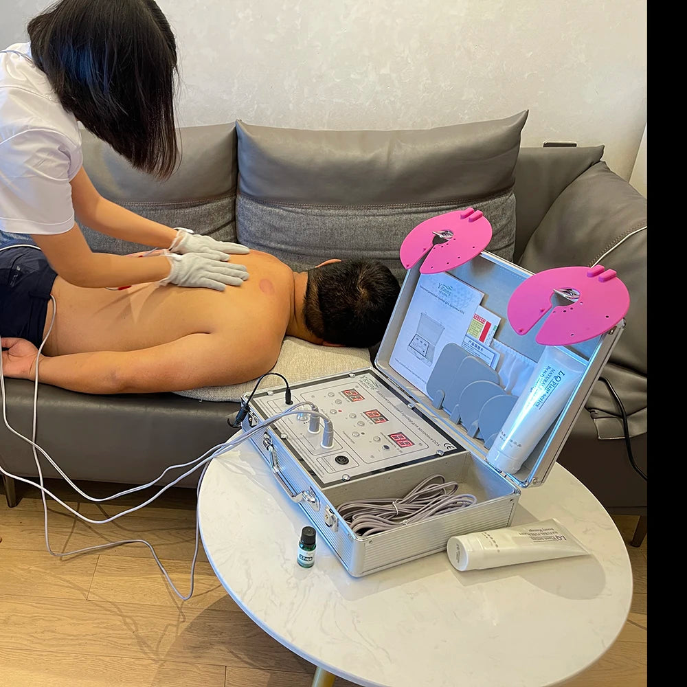 Portable DDS bioelectrical therapy device with silver control case for home body massage and electrotherapy treatment.