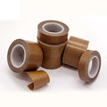 Brown PTFE silicone adhesive tape roll with inner core, shown in three angles