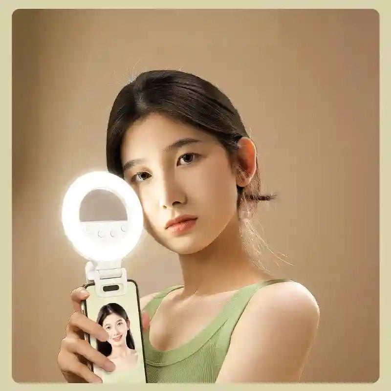 White portable clip-on ring light for smartphones, featuring adjustable brightness for selfies and video calls.