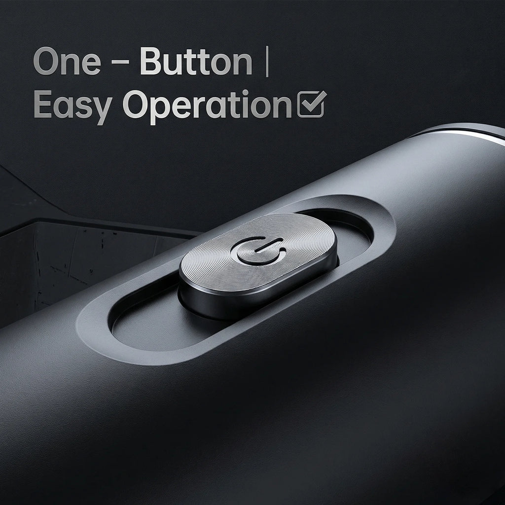 Close-up of a matte black portable coffee maker showing the metallic one-button power operation control.