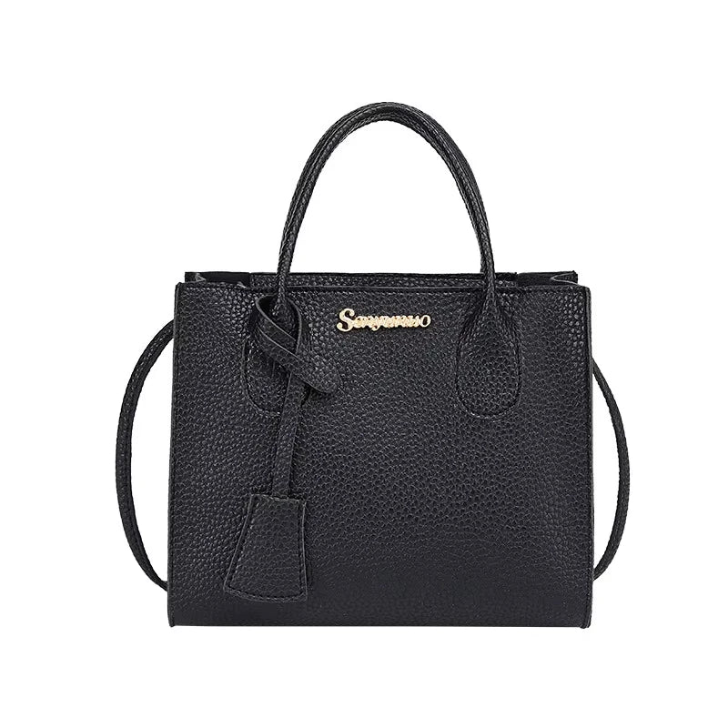 Black designer luxury handbag in textured waterproof PU leather with gold logo, top handles, and crossbody strap.