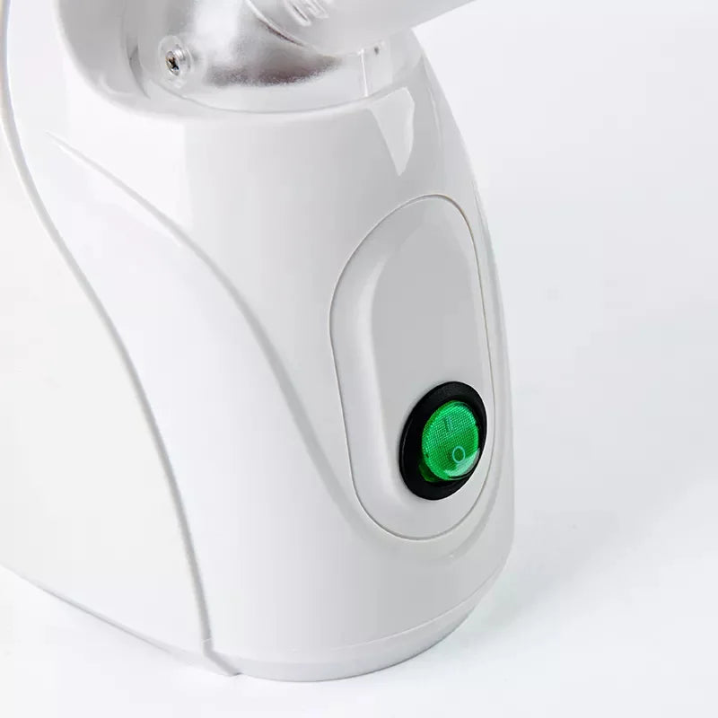 White ozone facial steamer with green power switch for home spa deep cleaning, skin care, and warm mist vaporization.