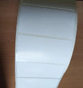 Blank white adhesive label sheet on backing with three rectangular label sections