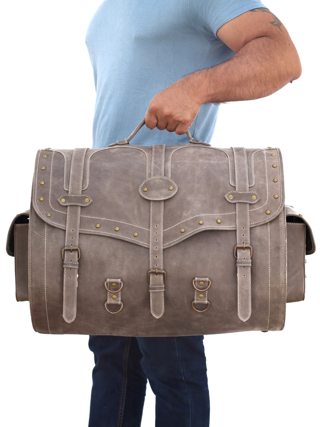 Vintage grey leather travel trunk with buckle straps, brass studs, and side pockets. Large capacity luggage for men.