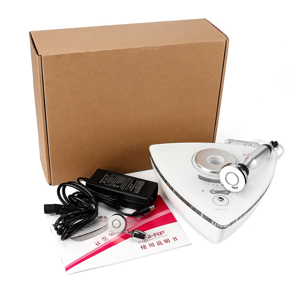 A white, triangular RF beauty device with metal probes, power adapter, user manual, and a plain brown cardboard box.