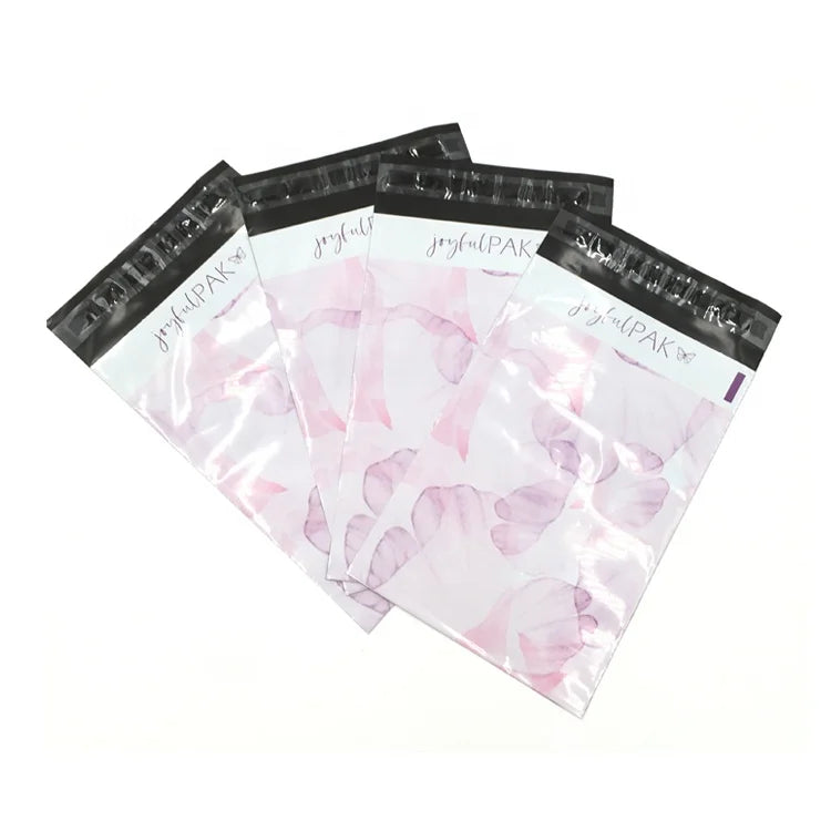 Set of pink translucent poly mailer bags with black top seal and joyfulPAK logo