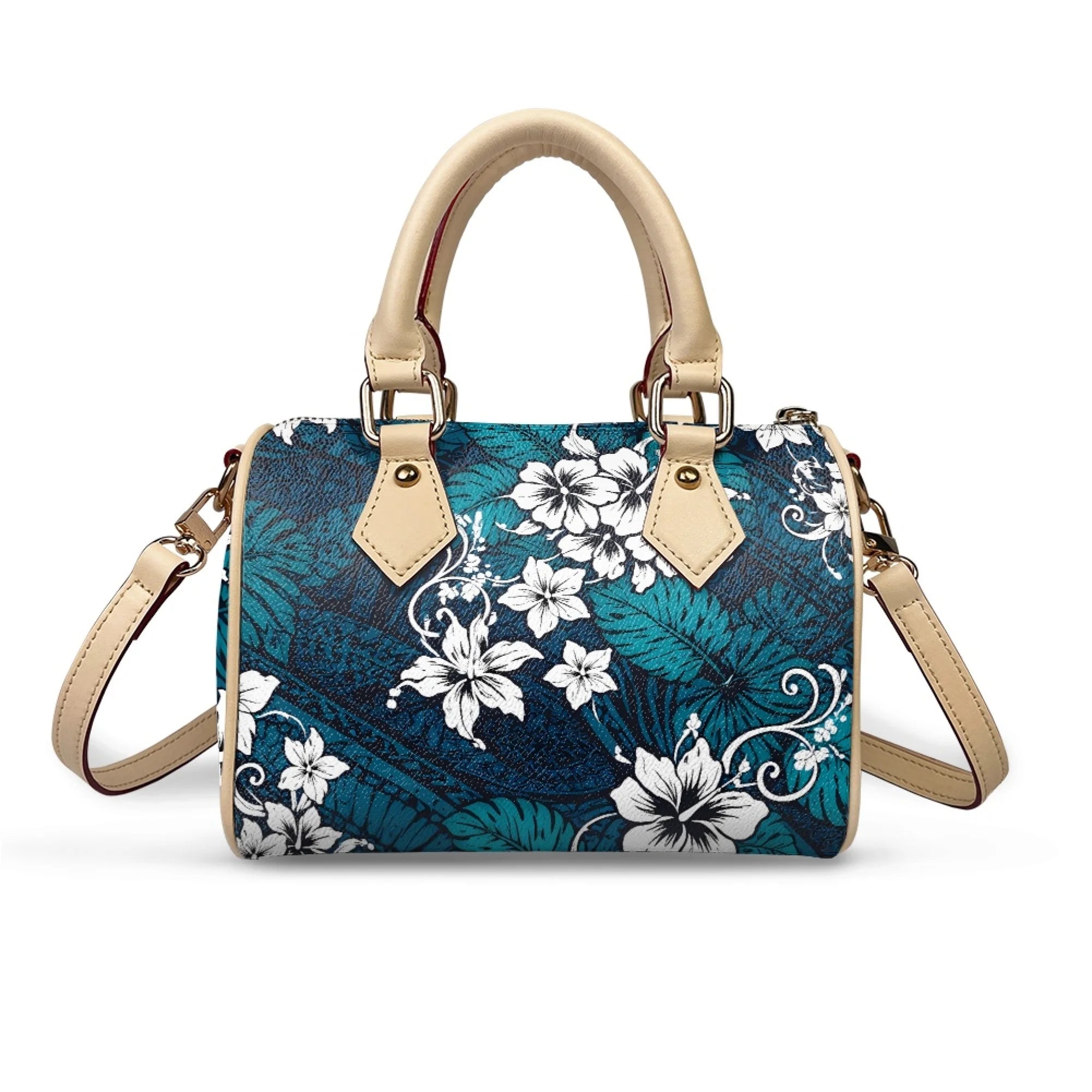 Teal floral trunk handbag with white hibiscus print, beige leather handles, and detachable crossbody strap.