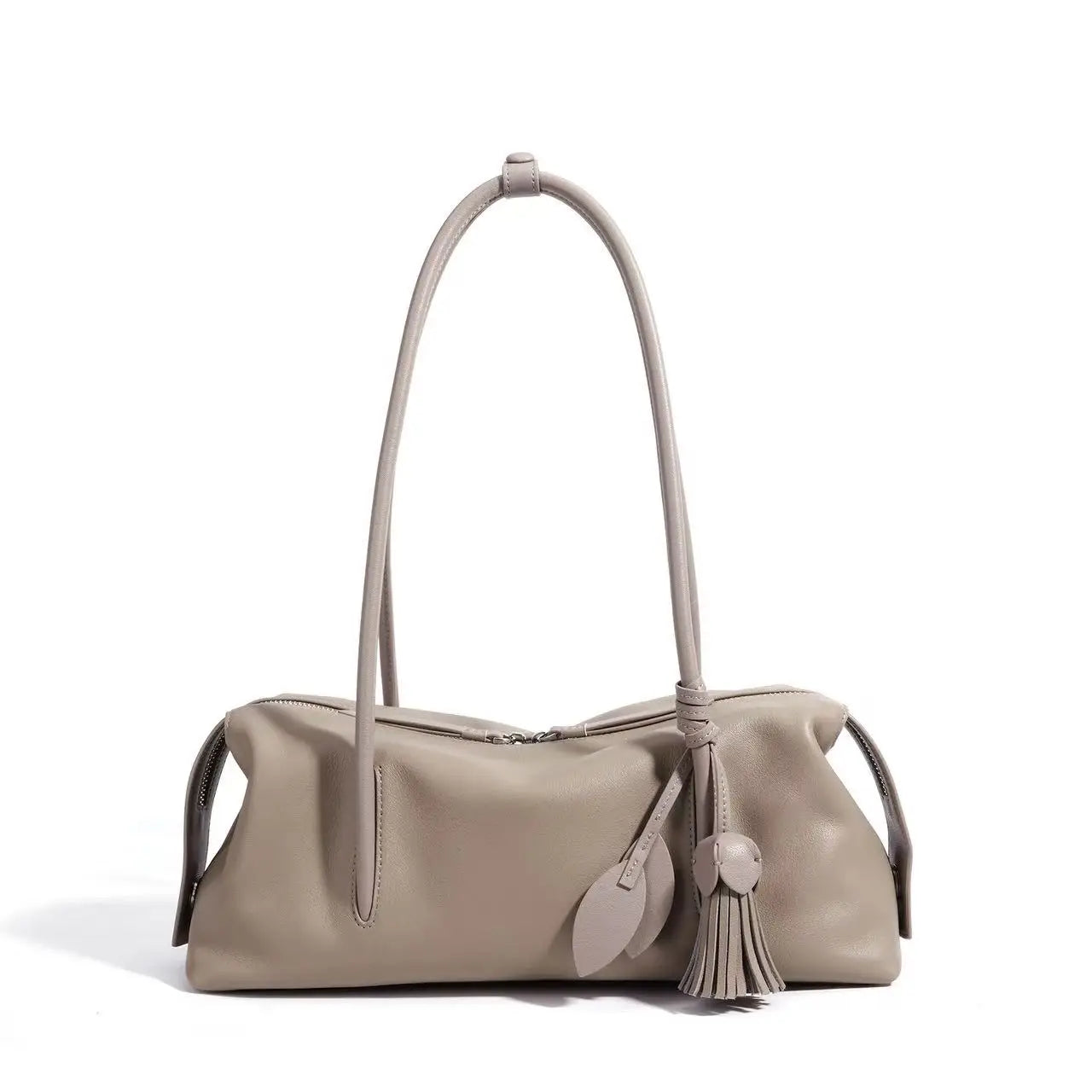 Taupe genuine cowhide leather shoulder bag, luxury underarm style with zip closure and decorative leaf tassel detail.