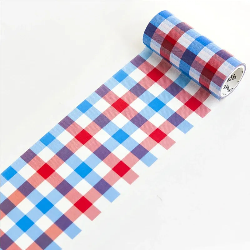 Blue, white, and red checkered decorative masking tape roll with gingham blocks