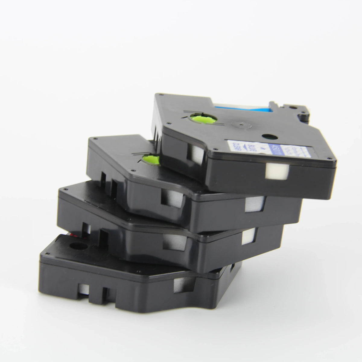 Stacked thermal label cassettes, black cartridges with green adjustment wheels
