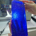 Dark blue synthetic hydrothermal crystal prism, close-up of textured surface.