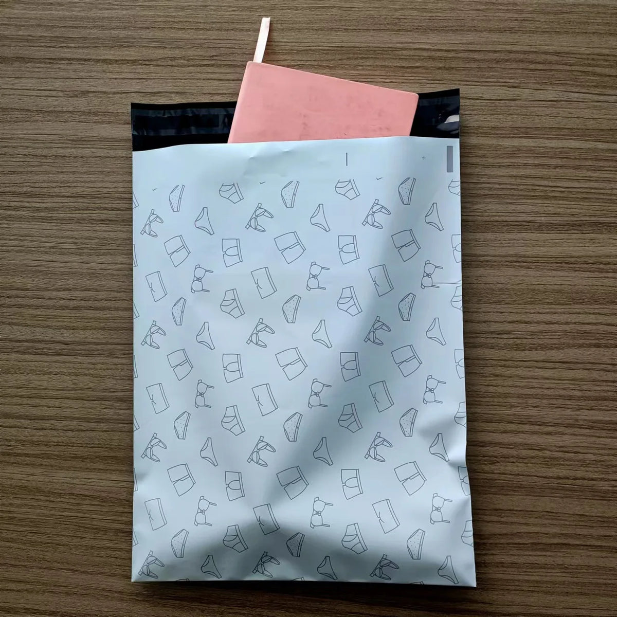 White poly mailer bag with repeating drink icon pattern
