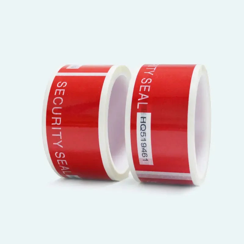 Two rolls of red security seal tape with white inner cores and “SECURITY SEAL” print