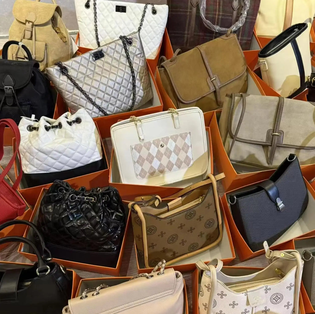 Collection of luxury designer trunks and messenger bags in quilted, suede, and logo-print leather, wholesale collection.