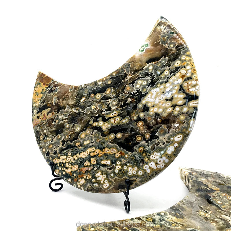 Ocean jasper crescent moon crystal with black-and-cream druzy speckles on black stand