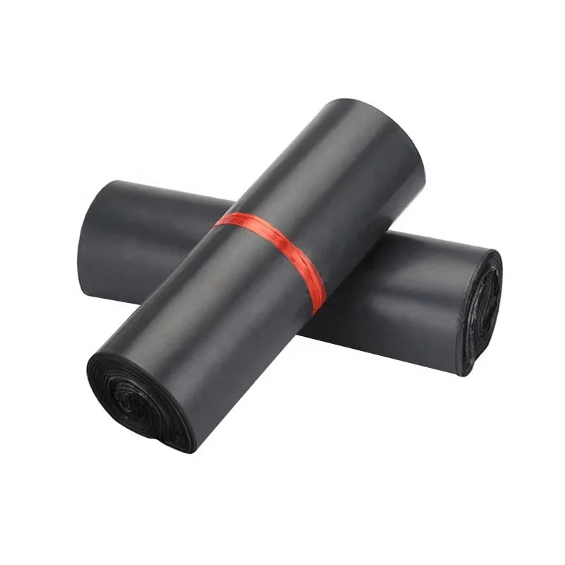 Black poly mailer rolls with red bands, bundled for shipping