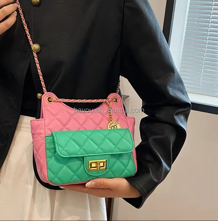 Pink and green quilted designer handbag with a gold chain strap, twist-lock closure, and luxe crossbody style.